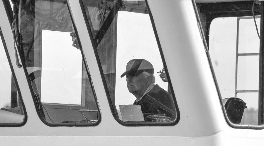 Jim O'Neill at the helm of the John Manning at Lock and Dam 11