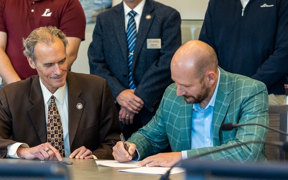 Binsfeld-Brennan-Signing UWL Partnership