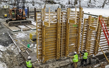 dam construction, concrete placement, winter construction, winter concrete placement, water retainage structures, dam construction contractors