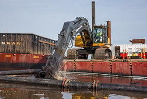 mechanical dredging equipment on river