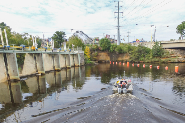 Brennan completing a survey of a hydroelectric dam