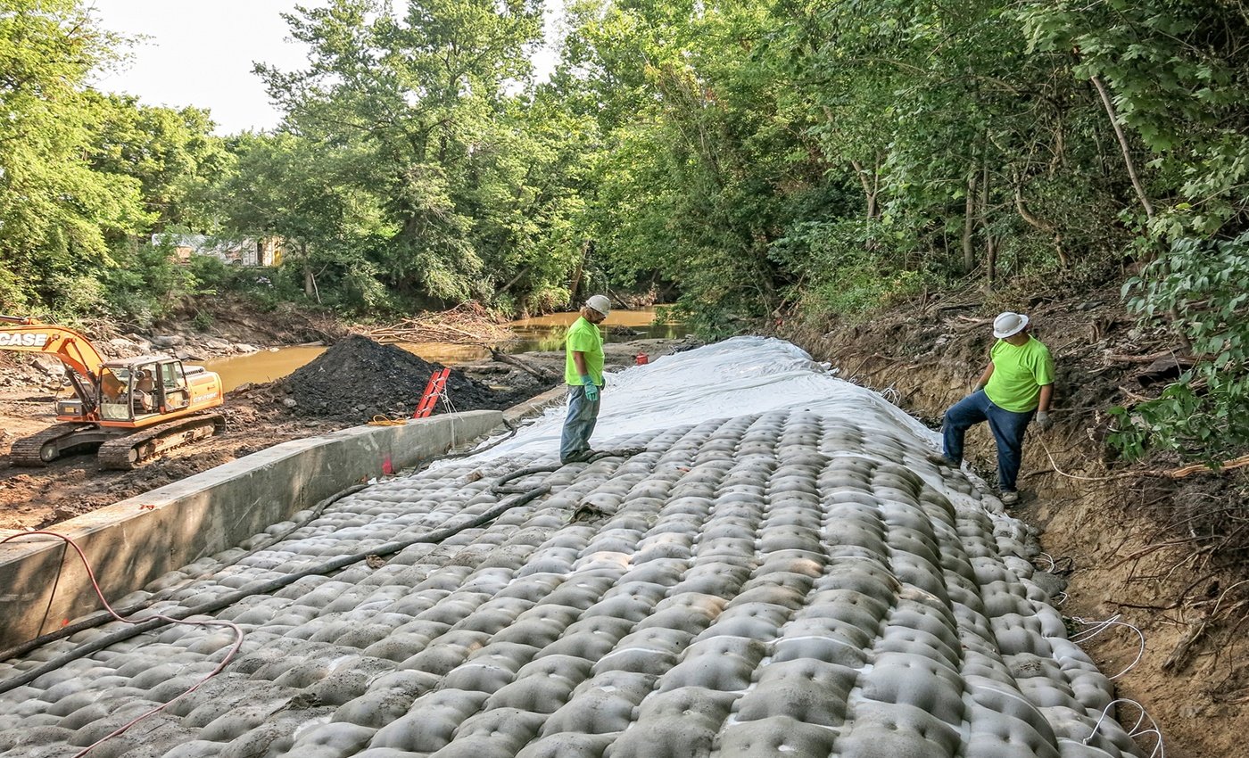 Brennan crew members install AB mats to prevent exposure of underlying sand or sediment.