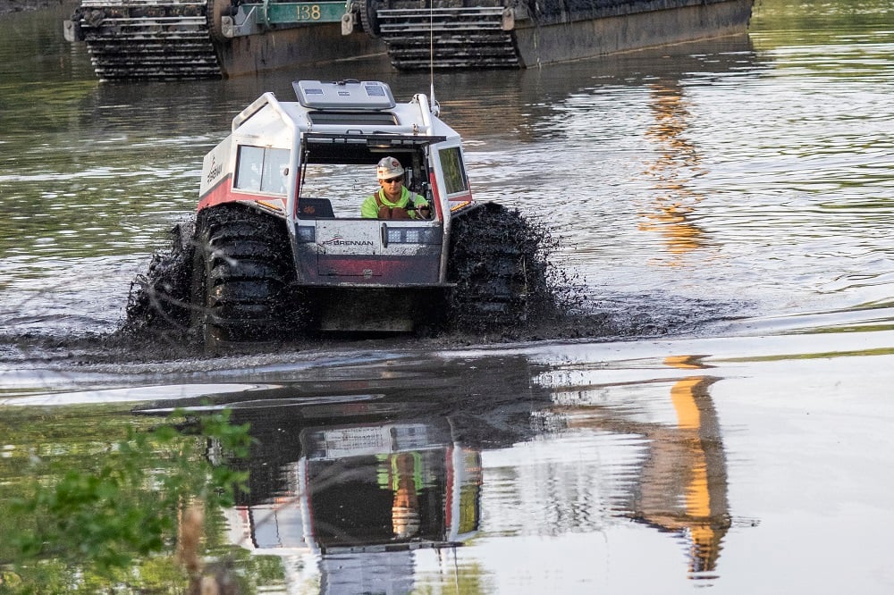 J.F. Brennan Company amphibious SHERP ATV on a wetland remediation project