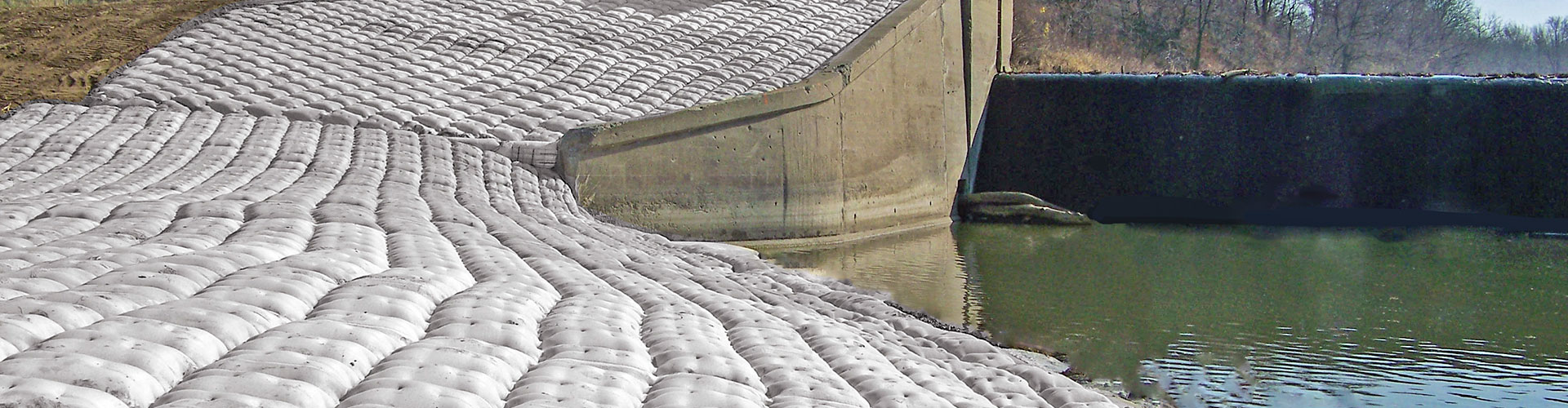 dam construction, scour remediation, scour control, fabric formed articulating block mats