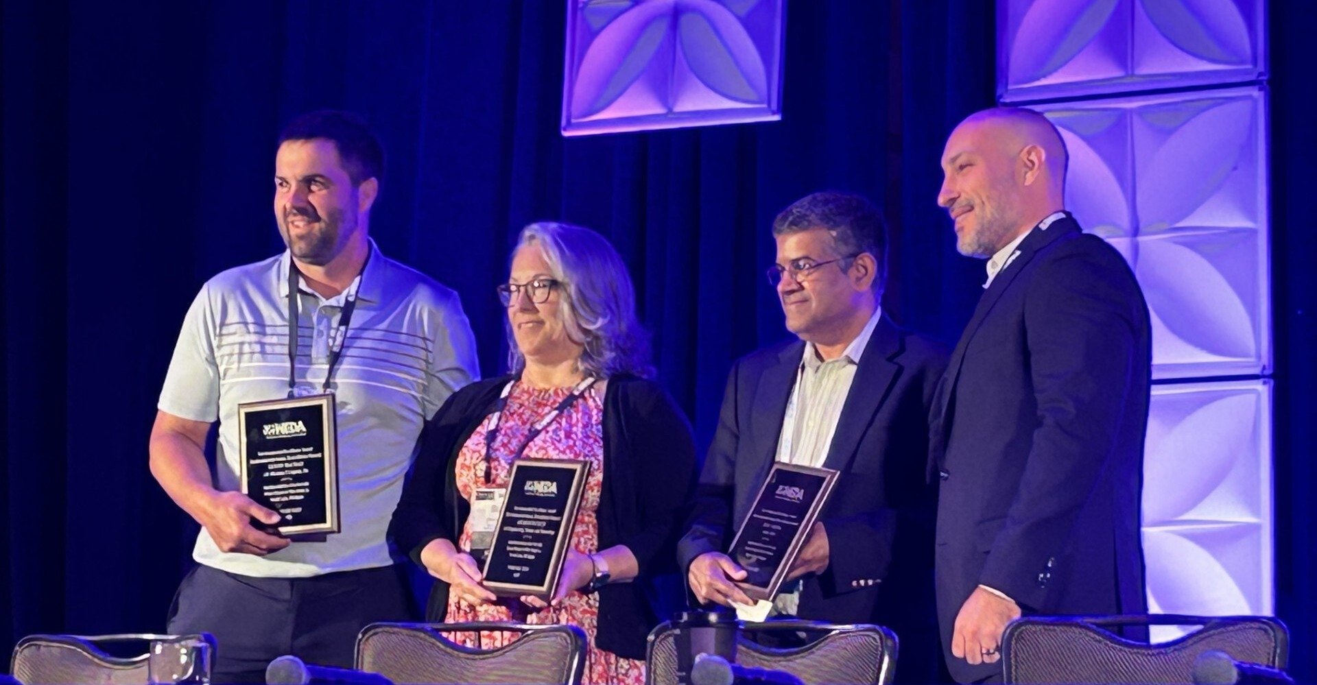 Photo of J.F. Brennan Company accepting excellence award