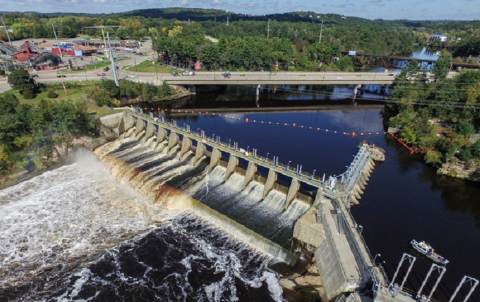 Brennan inspects and surveys a local hydropower dam