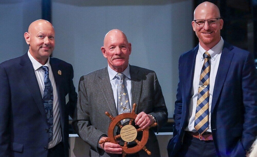 Photo of Adam and Tony Binsfeld accepting the National Rivers Hall of Fame Achievement Award